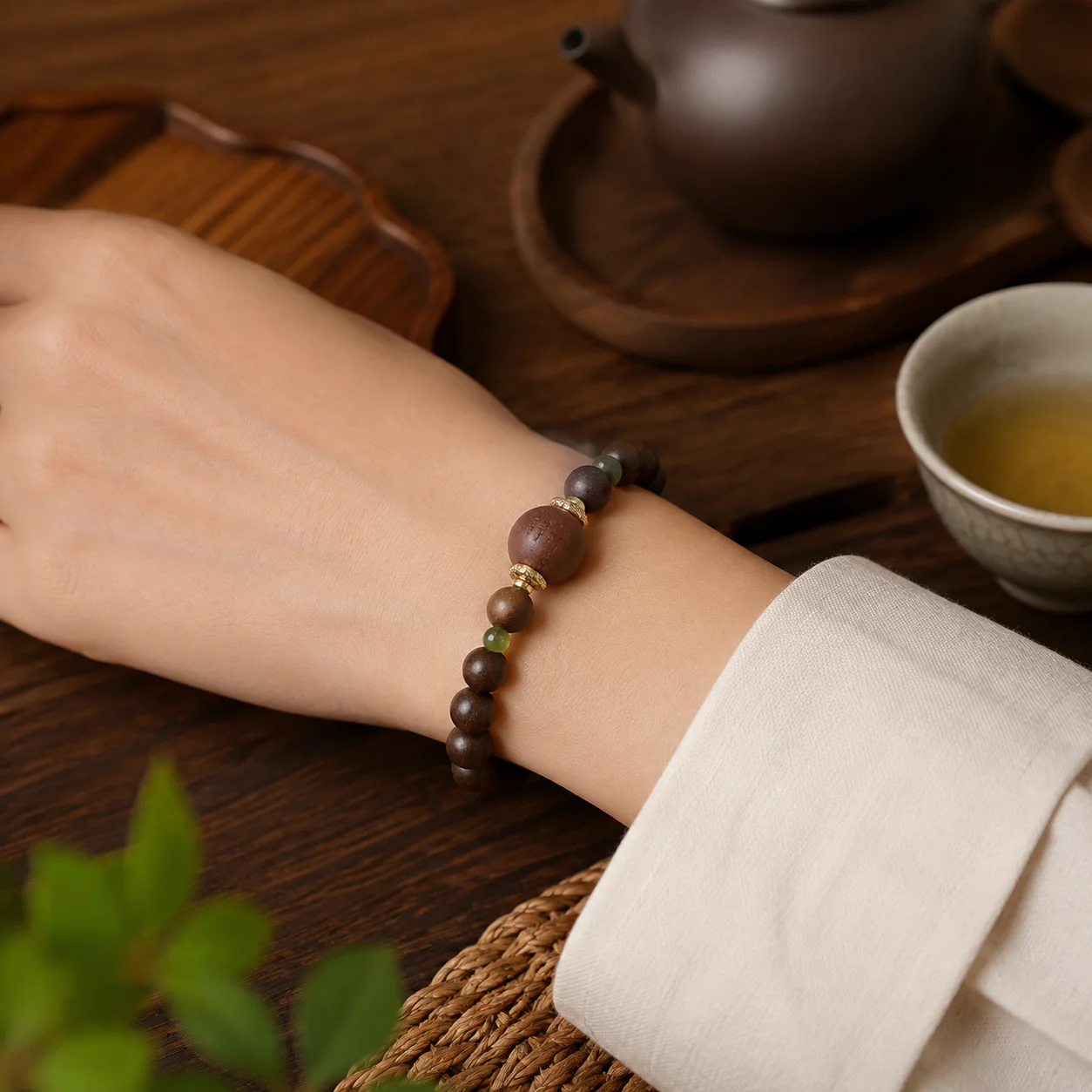 Dark wood bead bracelet worn with linen