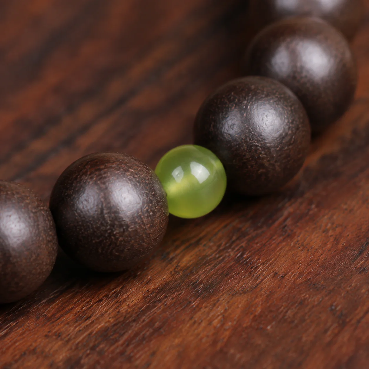 Dark wood bead bracelet olive green bead detail