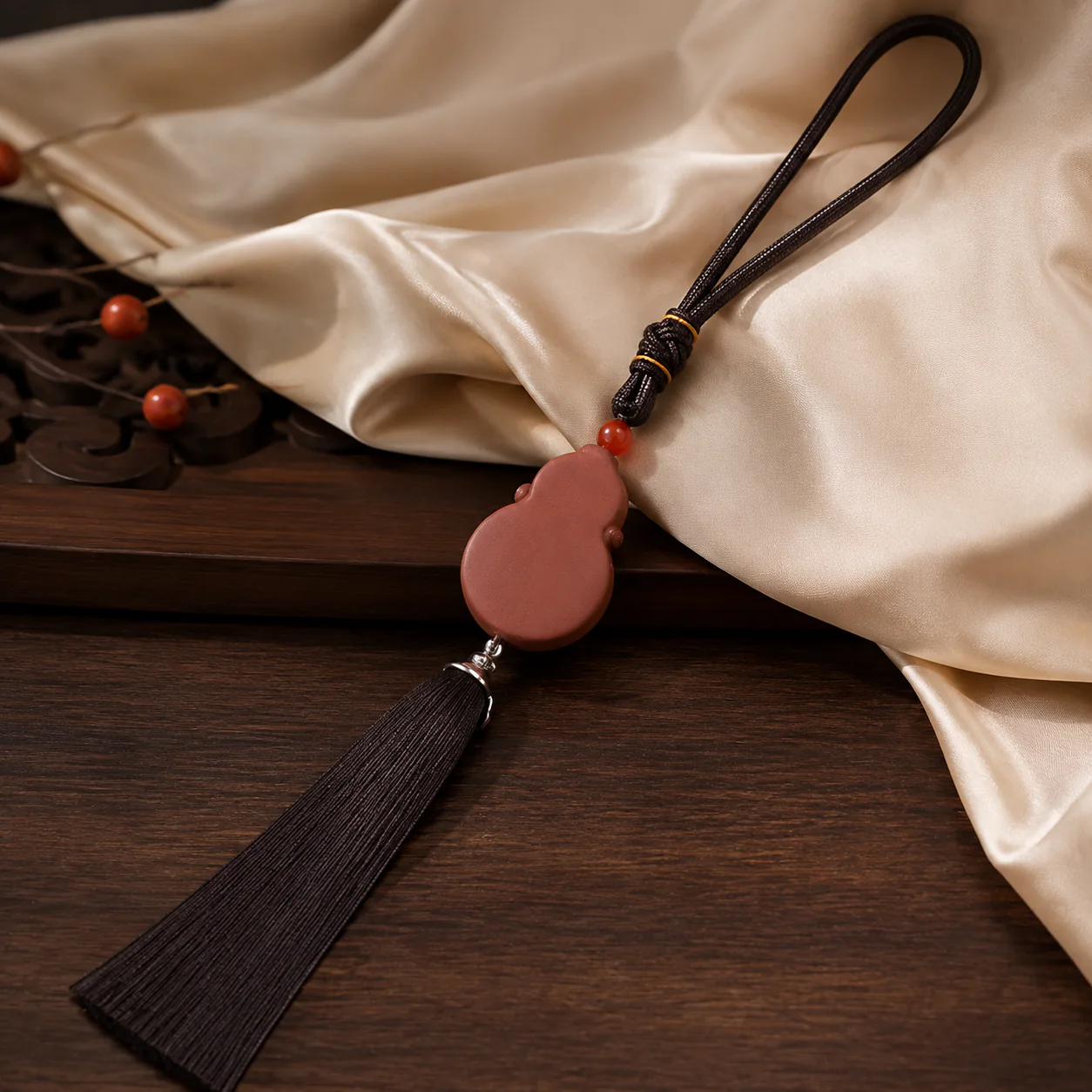 Terracotta gourd tassel pendant in a refined setting