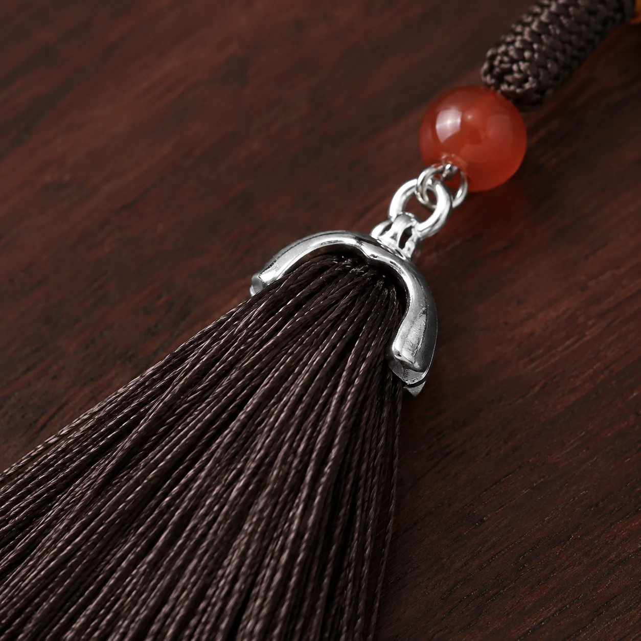 Dark tassel pendant detail