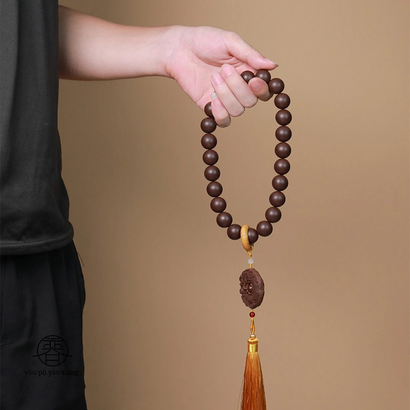 Incense bead tassel necklace with carved pendant