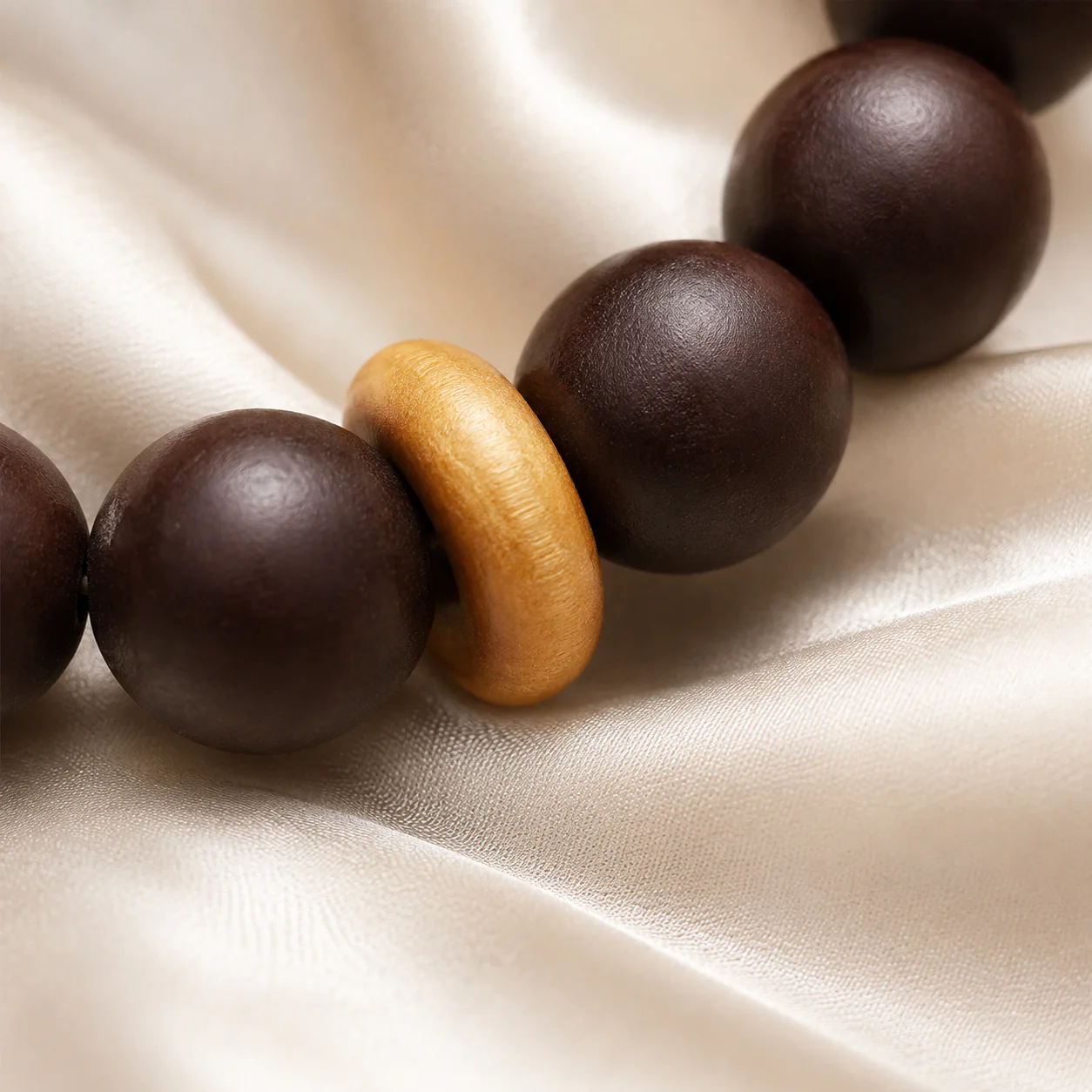 Dark wood beads and gold accent detail