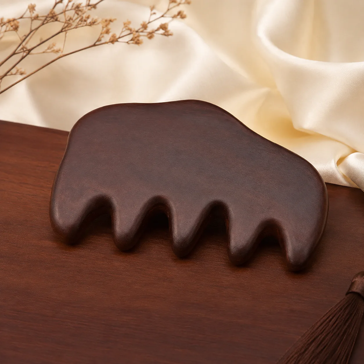 Dark wood comb in a refined setting