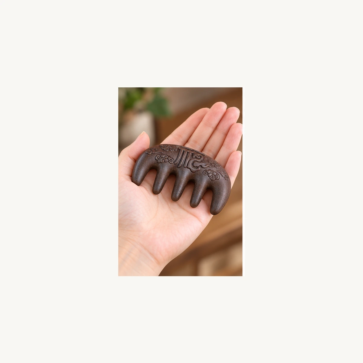 Compact five-tooth Hexiang incense comb shown in hand