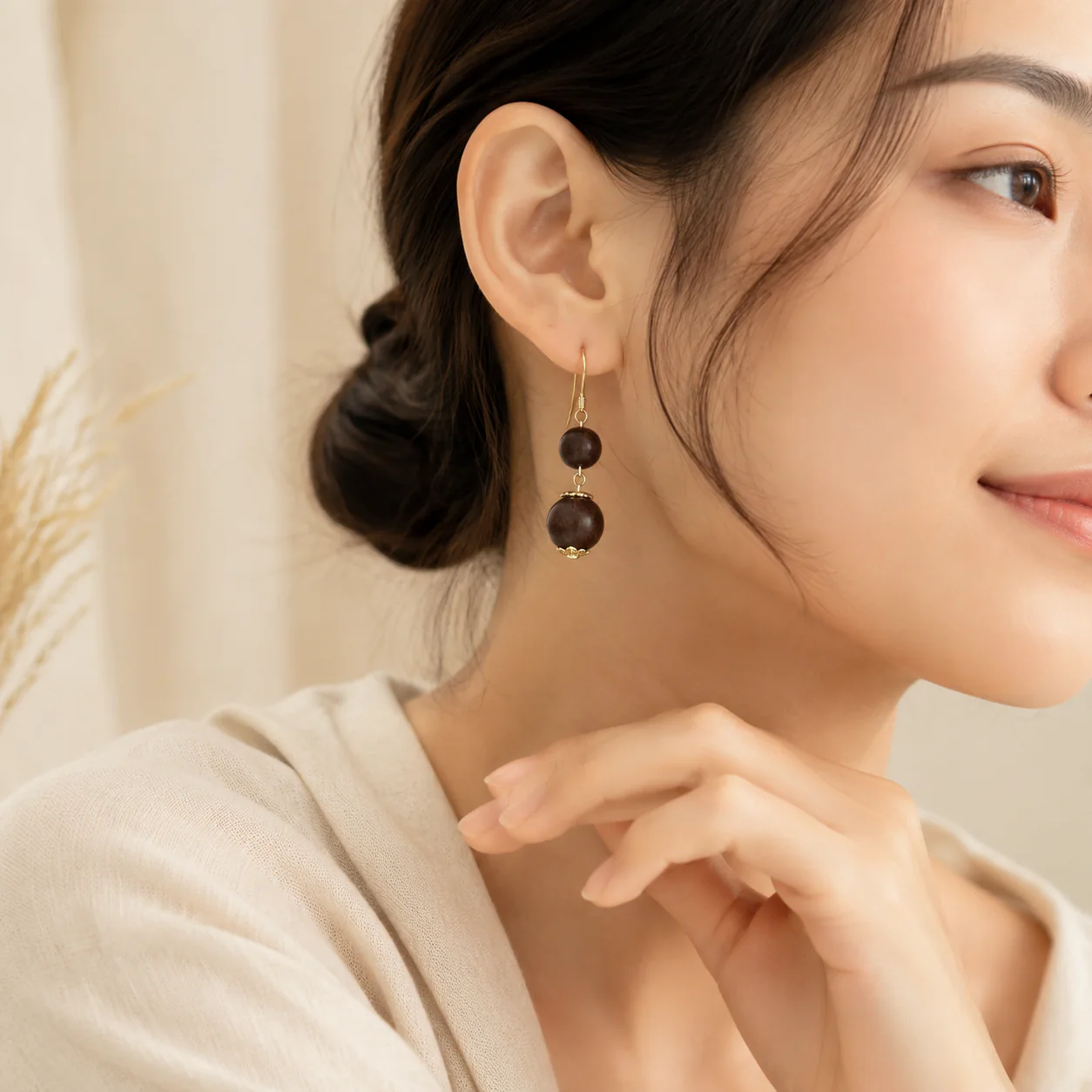 Brown wood bead drop earrings worn with linen