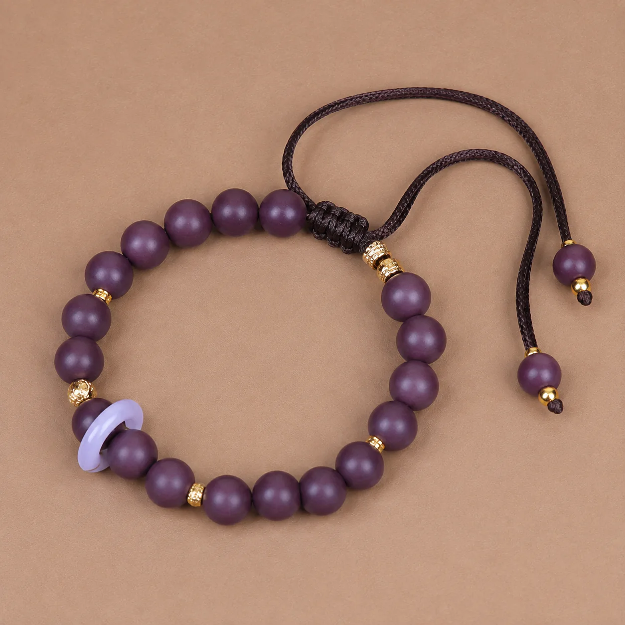 Plum wood bead bracelet cord detail