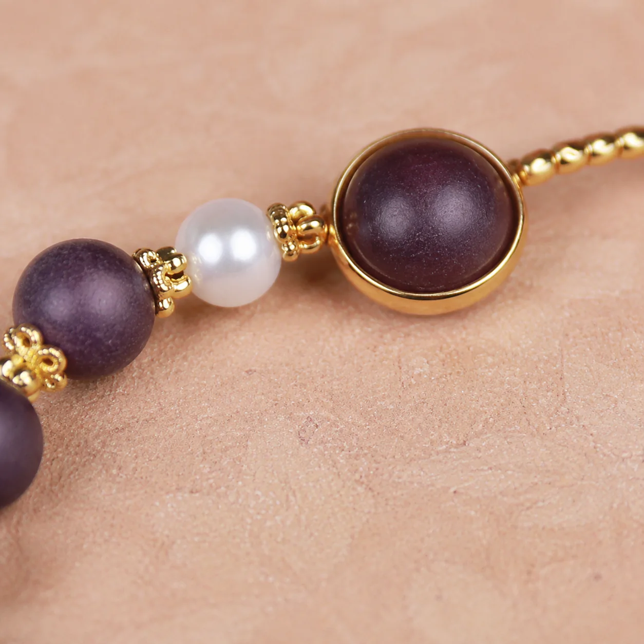 Plum wood bead and pearl bracelet material detail