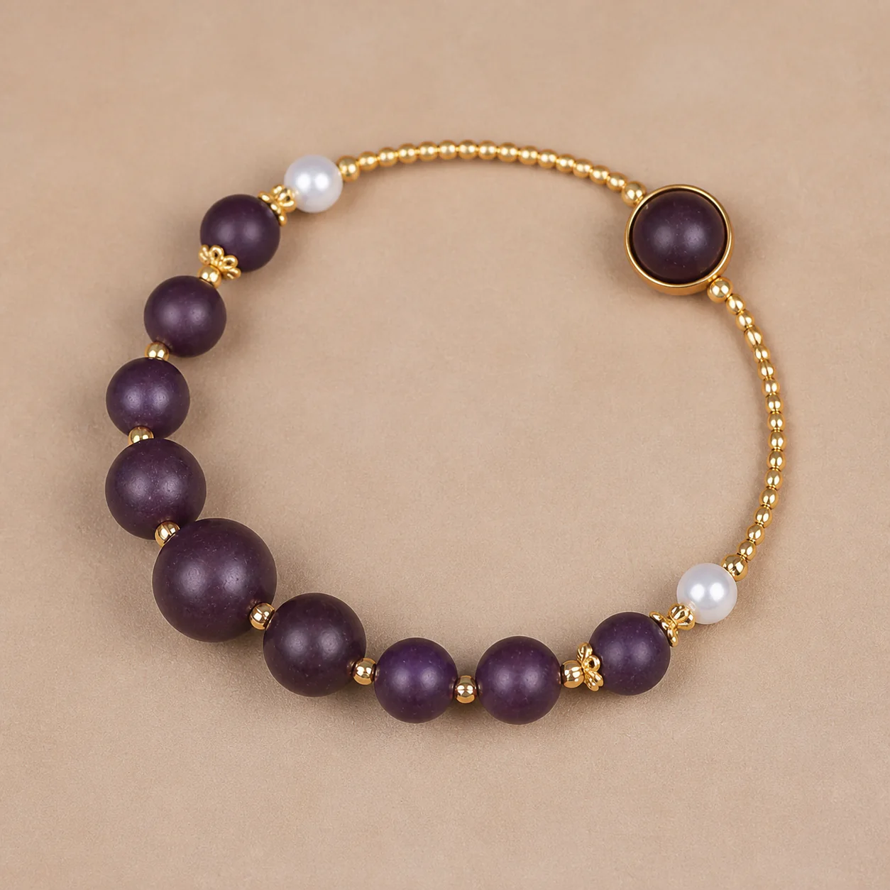 Plum wood bead and gold chain bracelet full silhouette detail