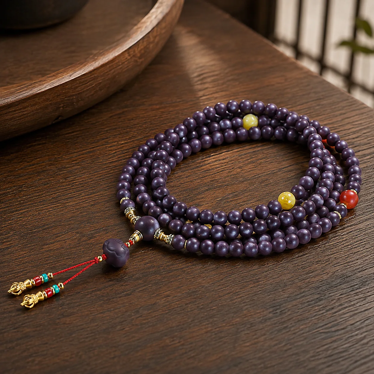 Plum wood bead prayer strand in a refined setting