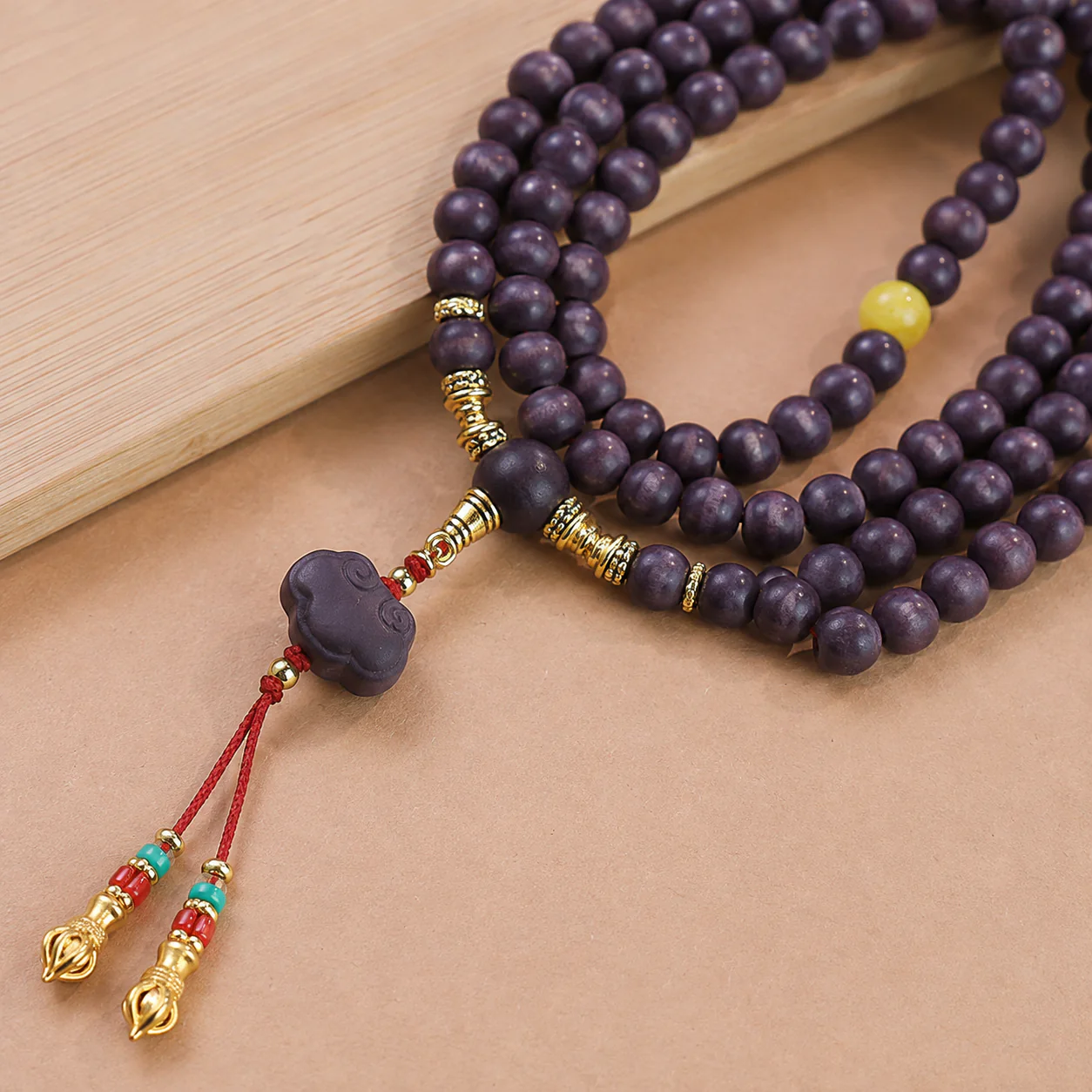 Plum wood bead prayer strand material detail