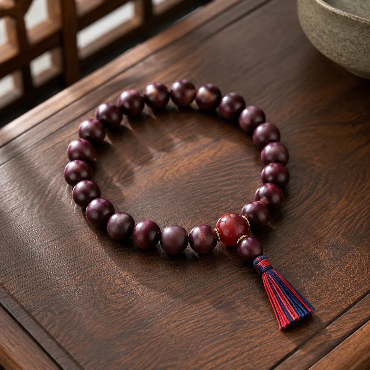 Plum wood bead bracelet in a refined setting