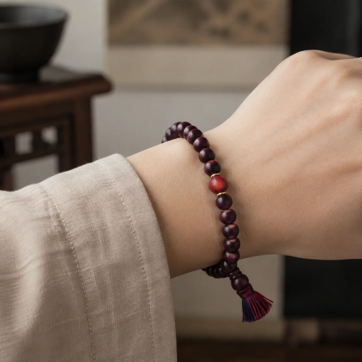 Plum wood bead bracelet worn with linen
