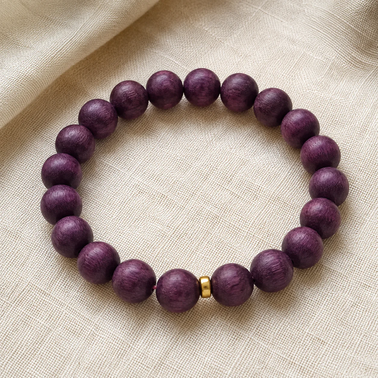 Plum wood bead bracelet flat lay detail