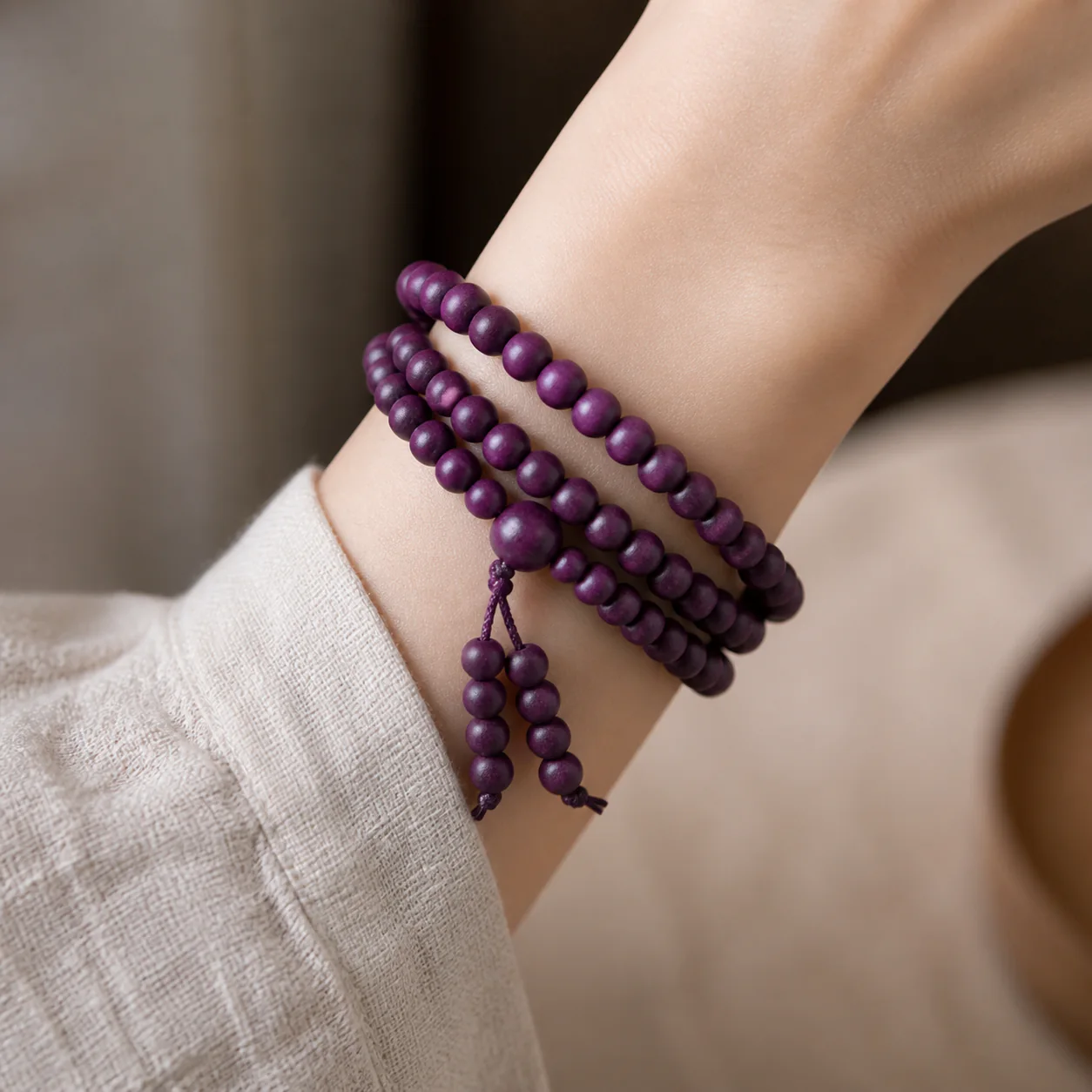 Plum wood multi-wrap bracelet worn with linen