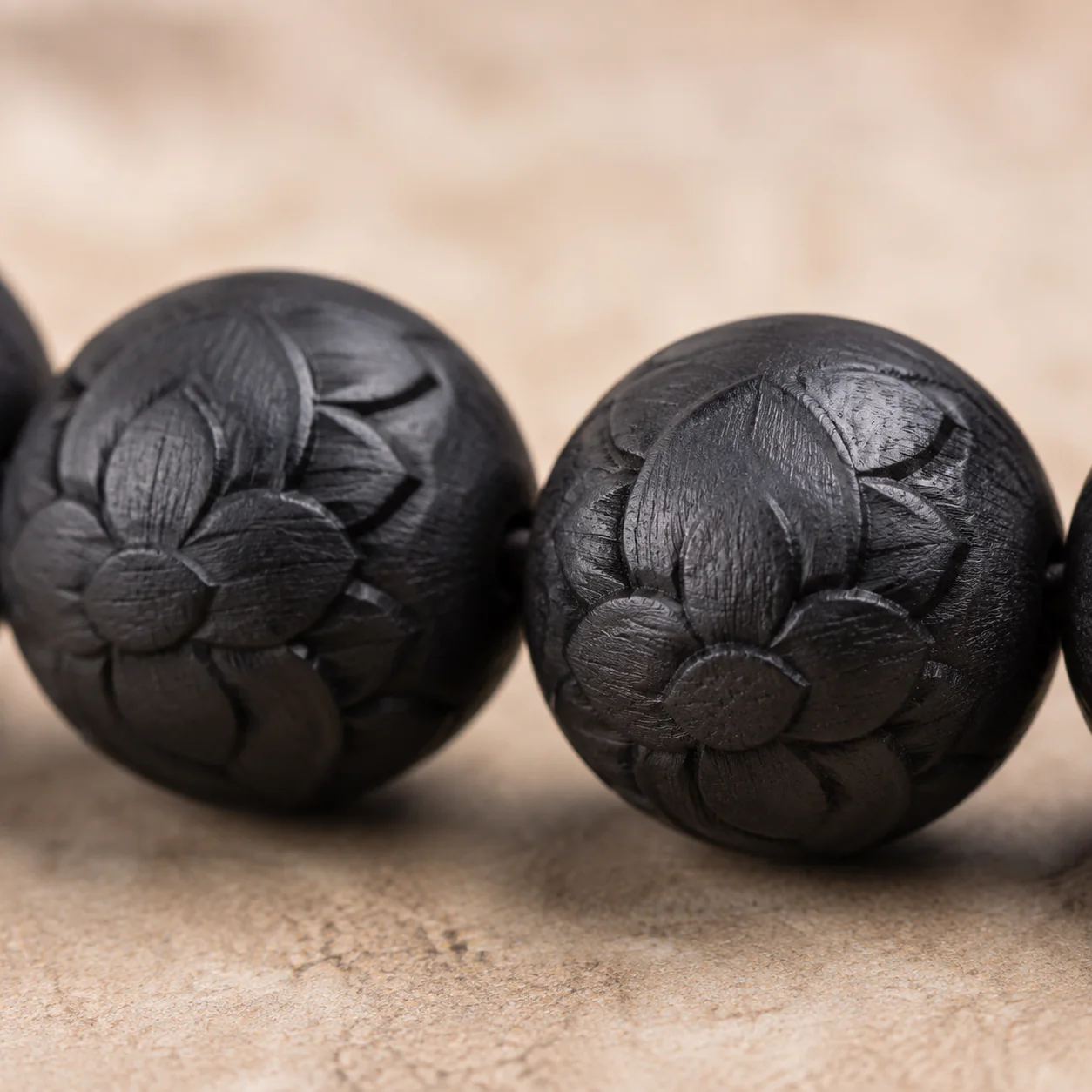 Lotus relief wood bead bracelet floral detail