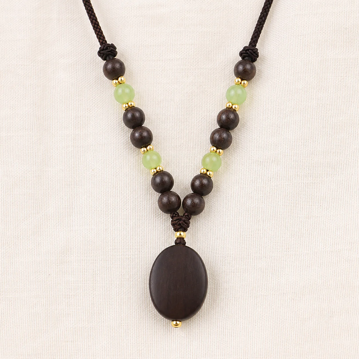 Dark wood bead pendant necklace material detail