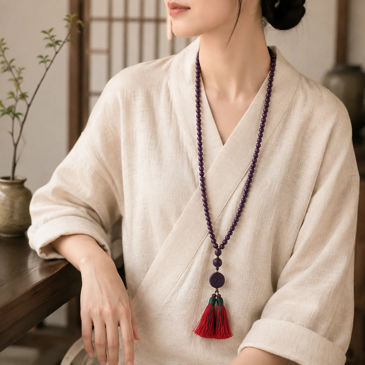 Purple wood bead mala worn with linen