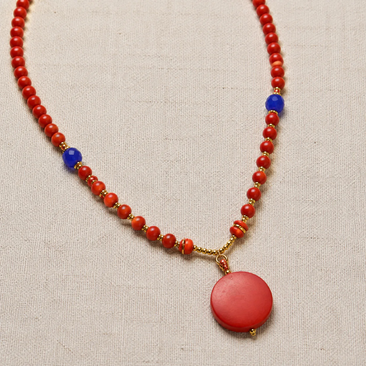 Red wood bead pendant necklace material detail