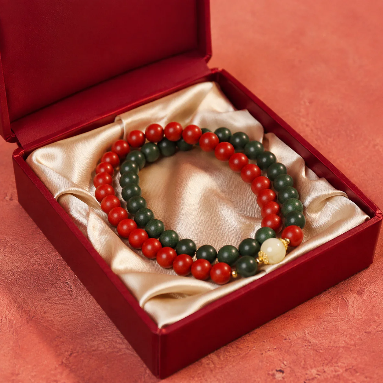 Red and green wood bead bracelet gift presentation