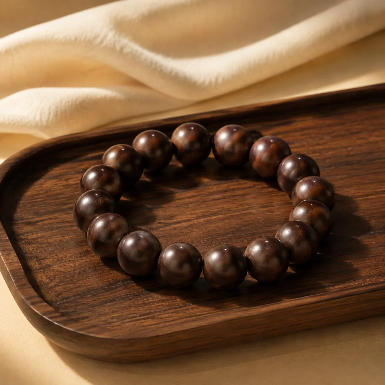 Dark wood bead bracelet in a refined setting