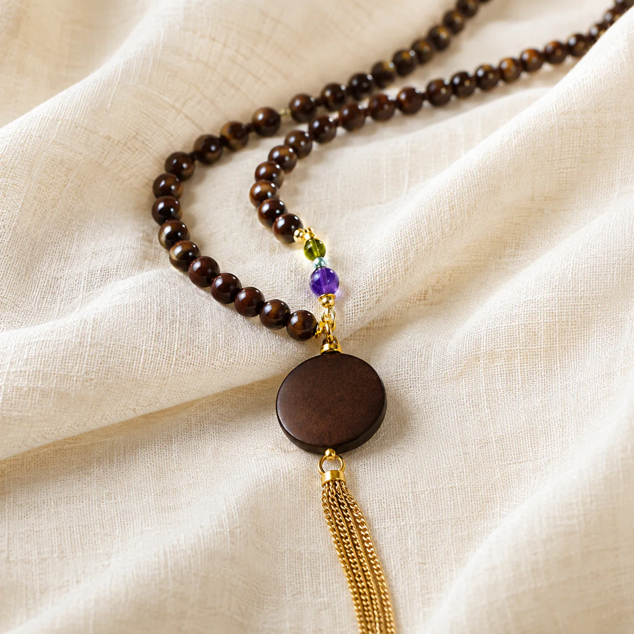 Long dark wood bead necklace pendant detail