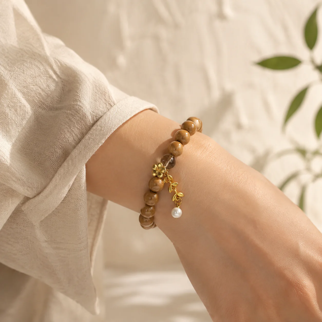 Honey brown wood bead bracelet worn with linen