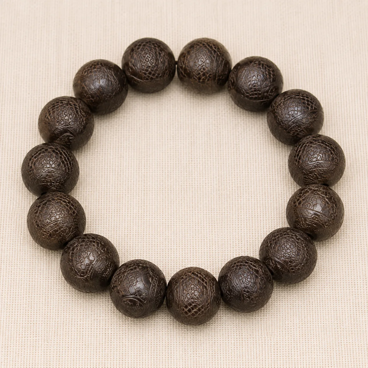 Dark carved wood bead bracelet full strand detail