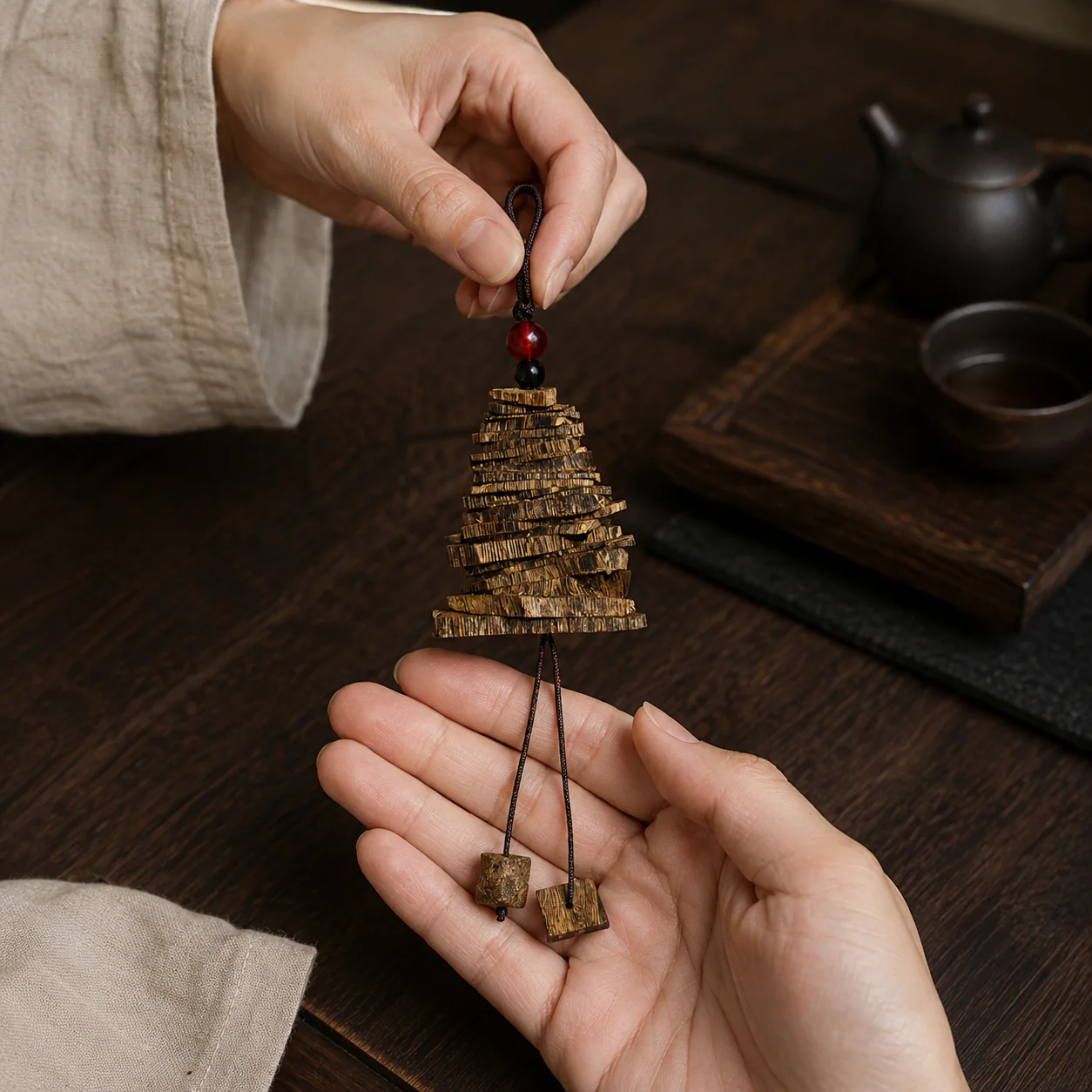Agarwood pagoda ornament held with linen