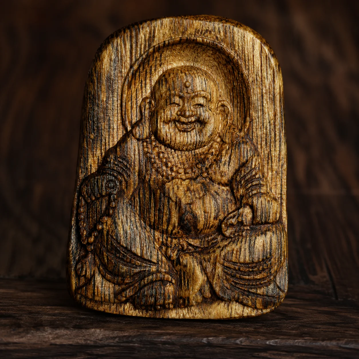 Carved agarwood Buddha pendant carving detail