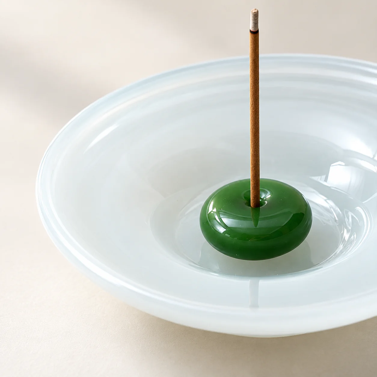 Ice-Jade Glass Incense Holder showing translucent glass and polished green insert detail