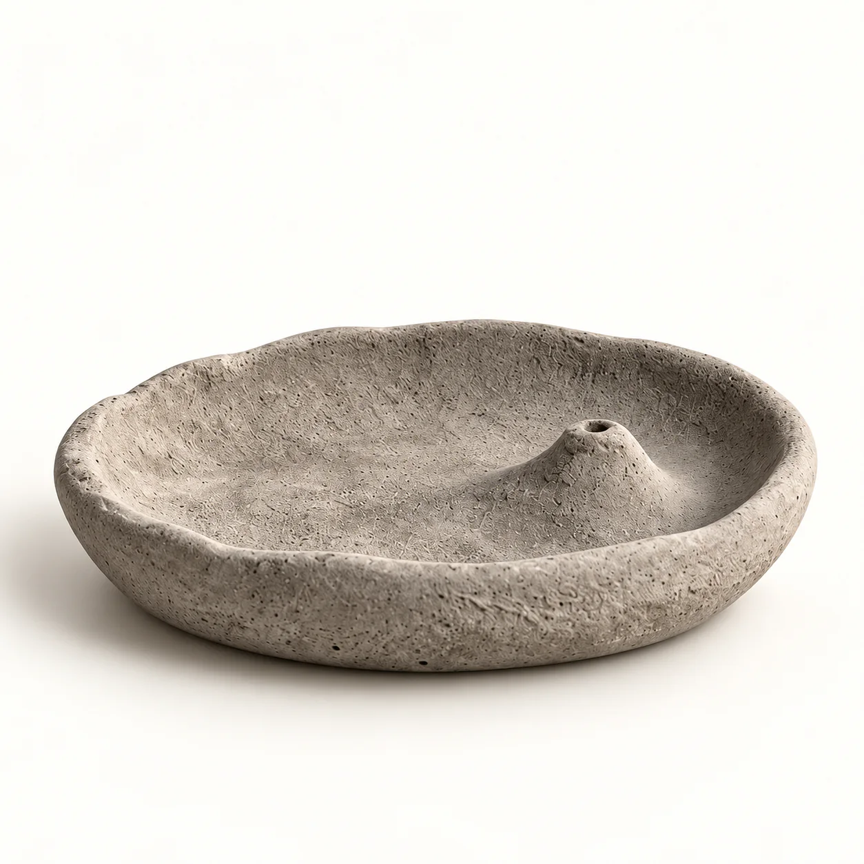Gray wabi-sabi cement incense tray on a white background
