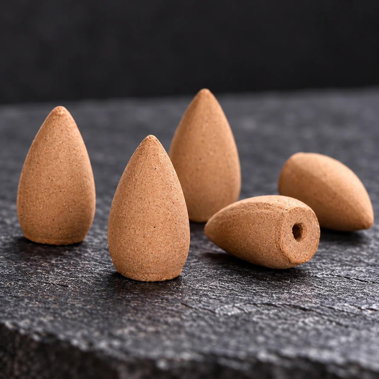 Close detail of pressed aromatic cone incense texture