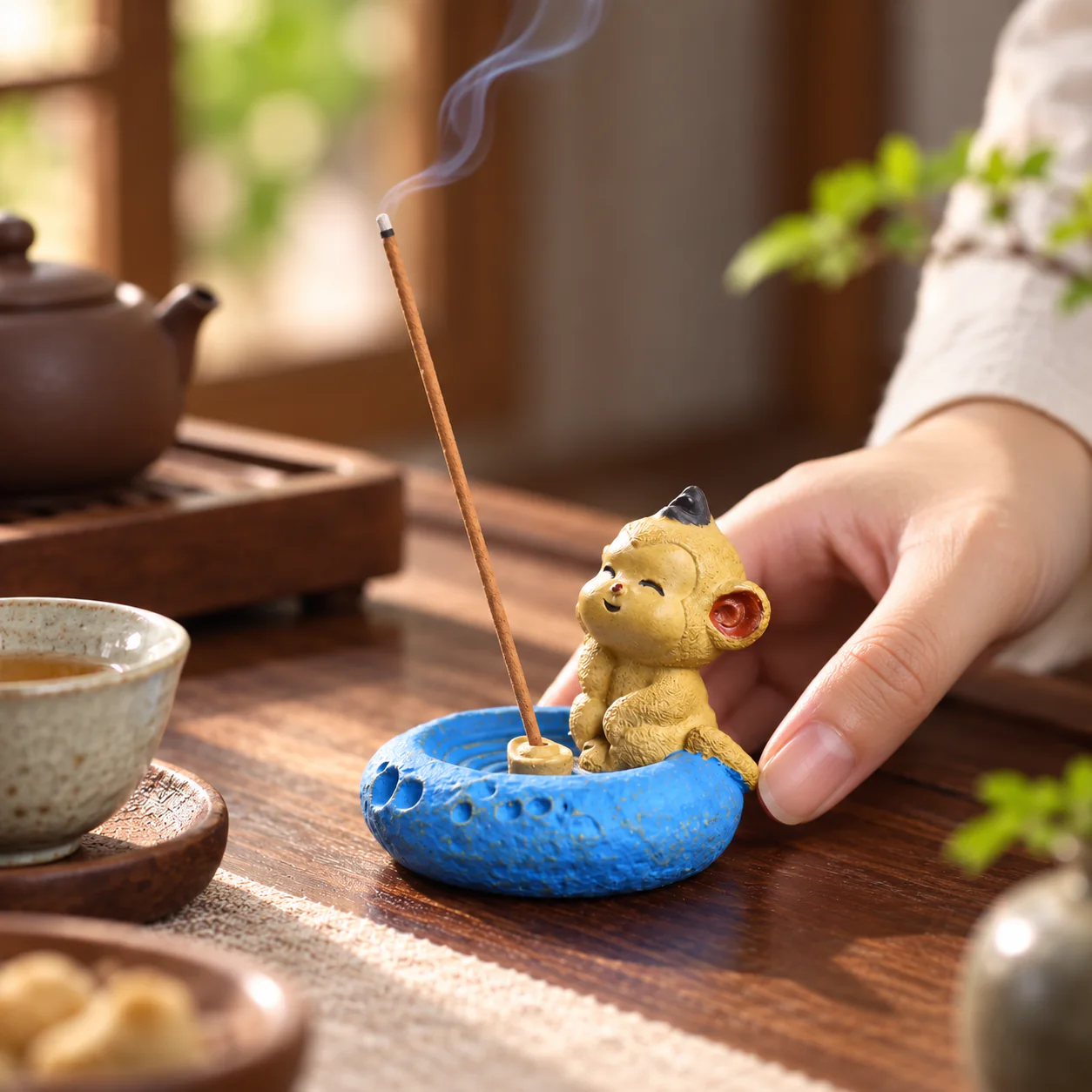 Zodiac Figurine Clay Incense Holder in use on a peaceful tea table