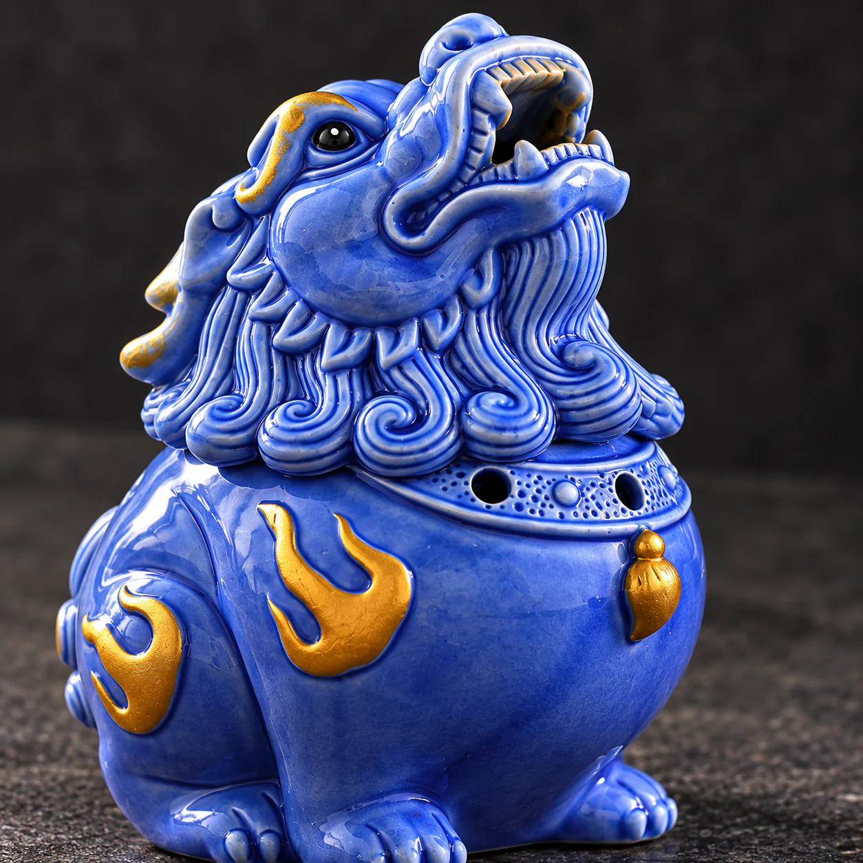 Celestial Guardian Ceramic Coil Incense Burner showing cobalt glaze and gold flame detail