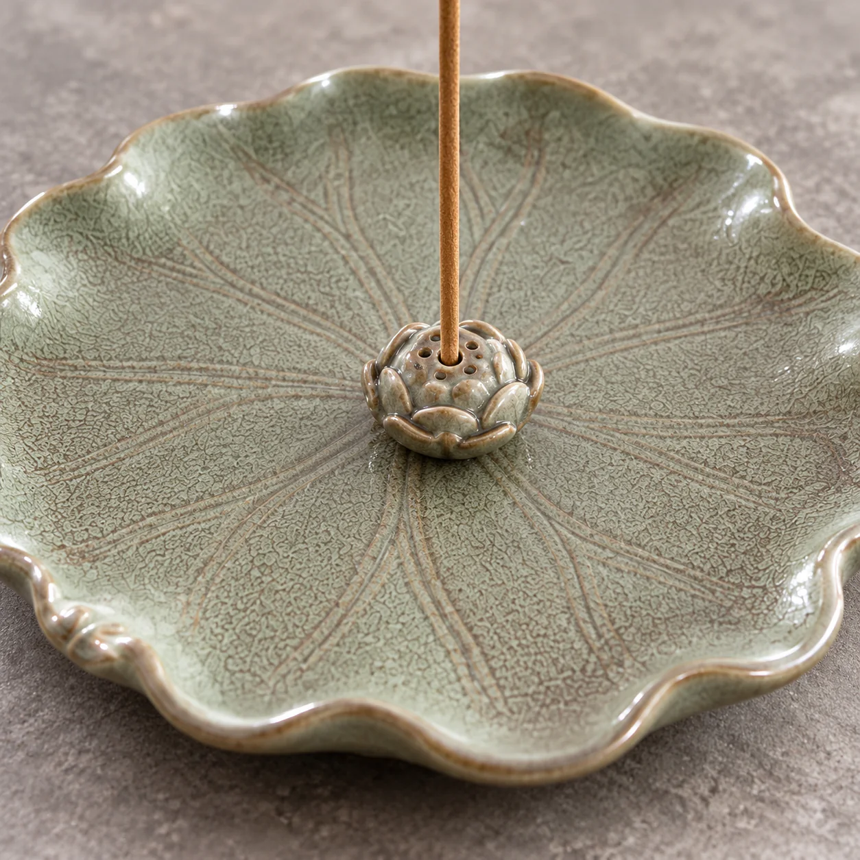 Vintage Lotus Ceramic Stick Incense Holder showing celadon glaze and leaf-vein relief