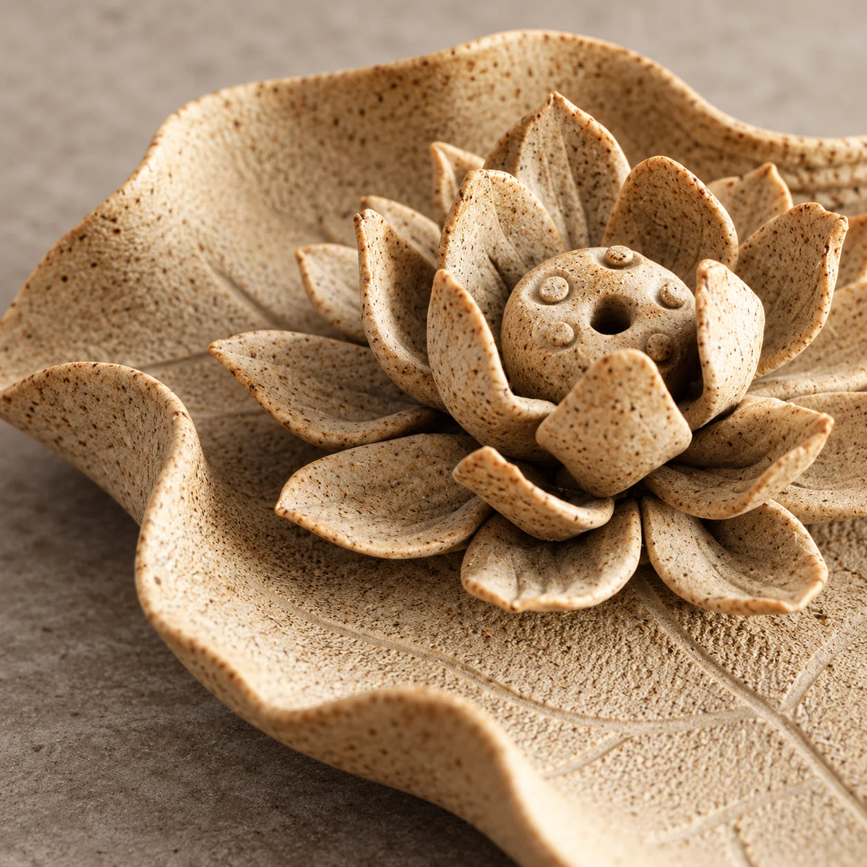Rustic Lotus Earthenware Incense Holder showing layered petals and speckled clay detail