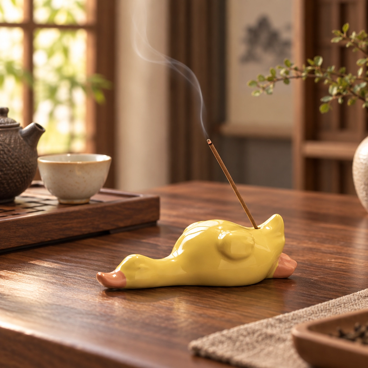 Playful Duck Ceramic Incense Holder in a calm tea-table setting
