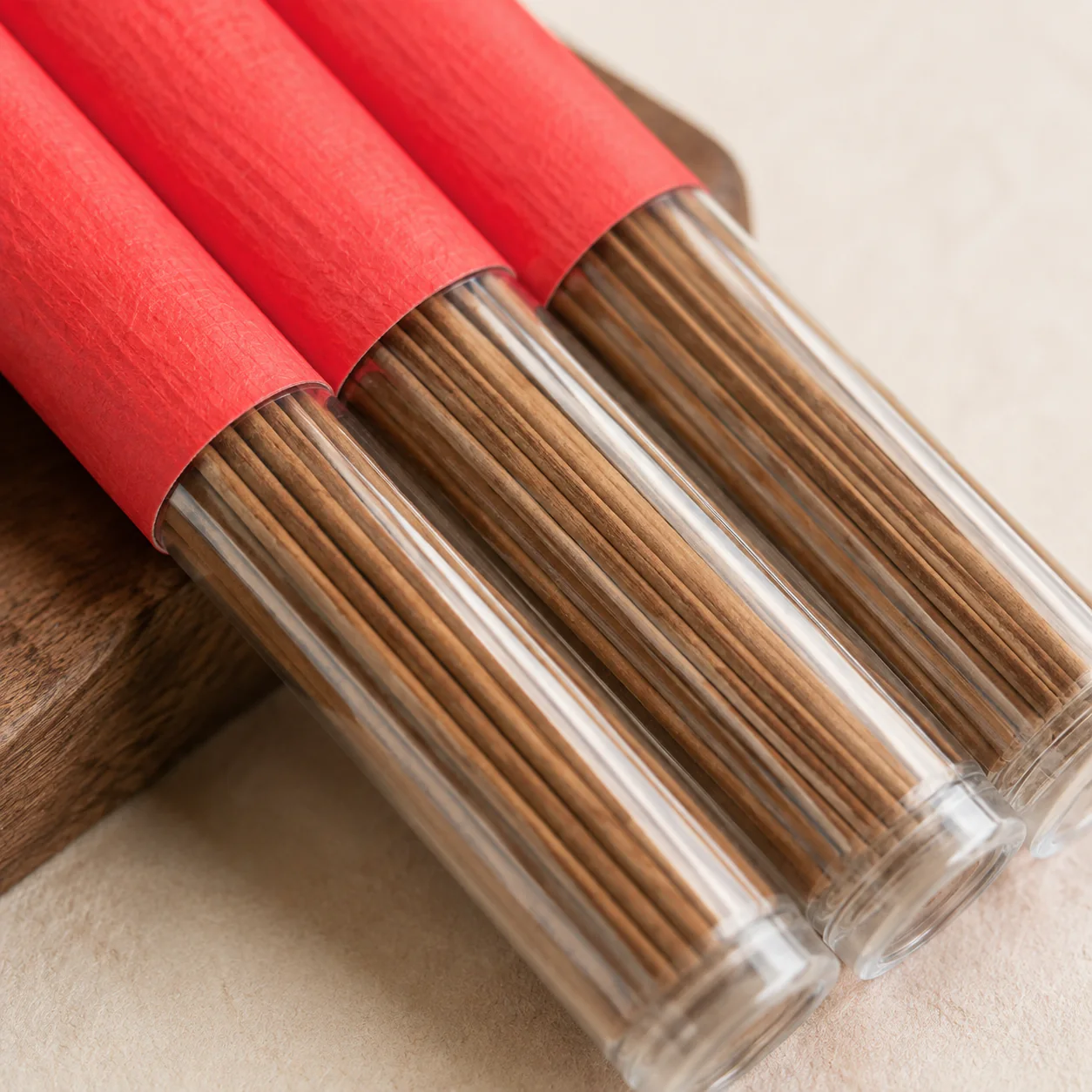 Agarwood incense sticks visible through clear tubes