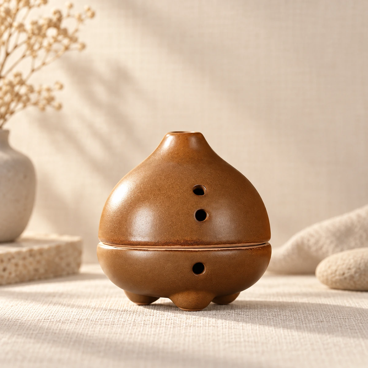 Pear-shaped lidded ceramic incense burner