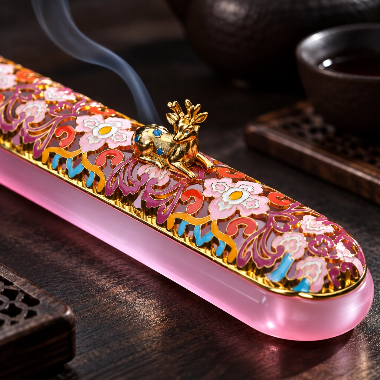 Close-up of the glossy floral enamel-like finish and deer ornament