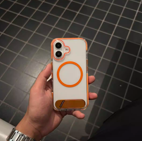 Real-life photo of clear iPhone case with orange magnetic ring bumper, slim protection