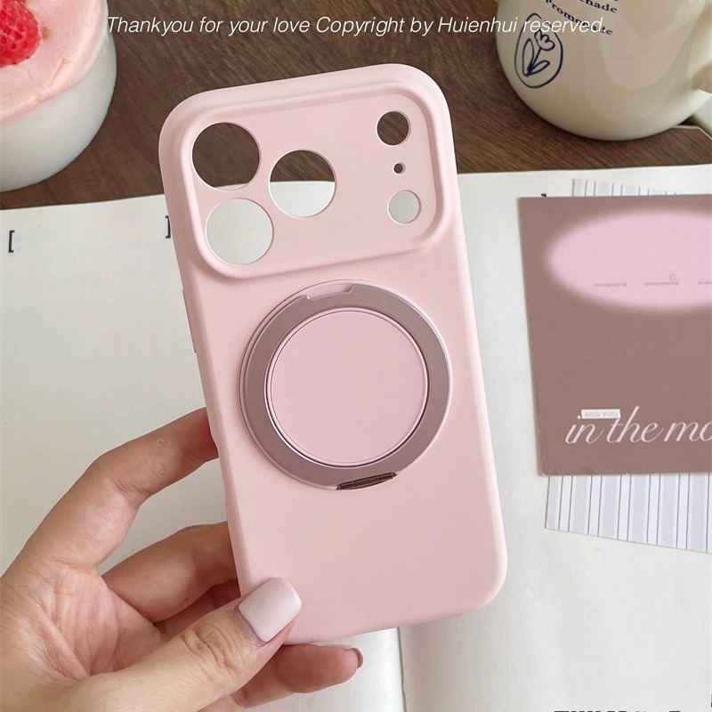 Pastel pink MagSafe magnetic ring iPhone case shown in hand, matte protective cover