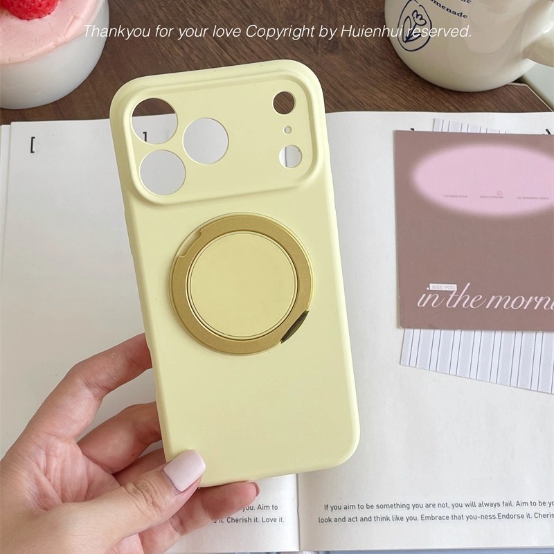 Soft yellow MagSafe magnetic ring iPhone case shown in hand, minimalist cover