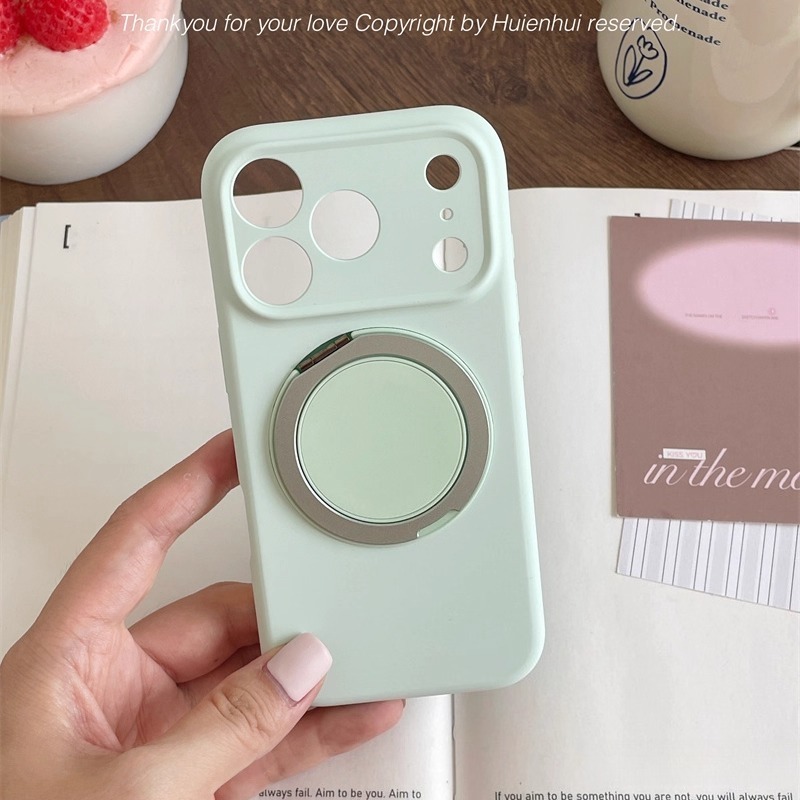 Mint green MagSafe magnetic ring iPhone case shown in hand, matte protective cover