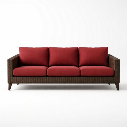 Divano a tre posti in rattan con cuscini rossi
