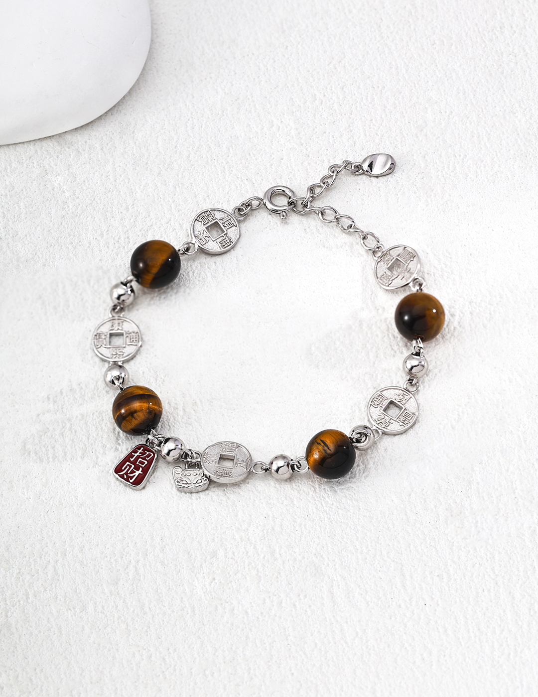 S925 sterling silver bracelet with citrine, crystal, and tiger's eye stones (believed to bring good fortune).