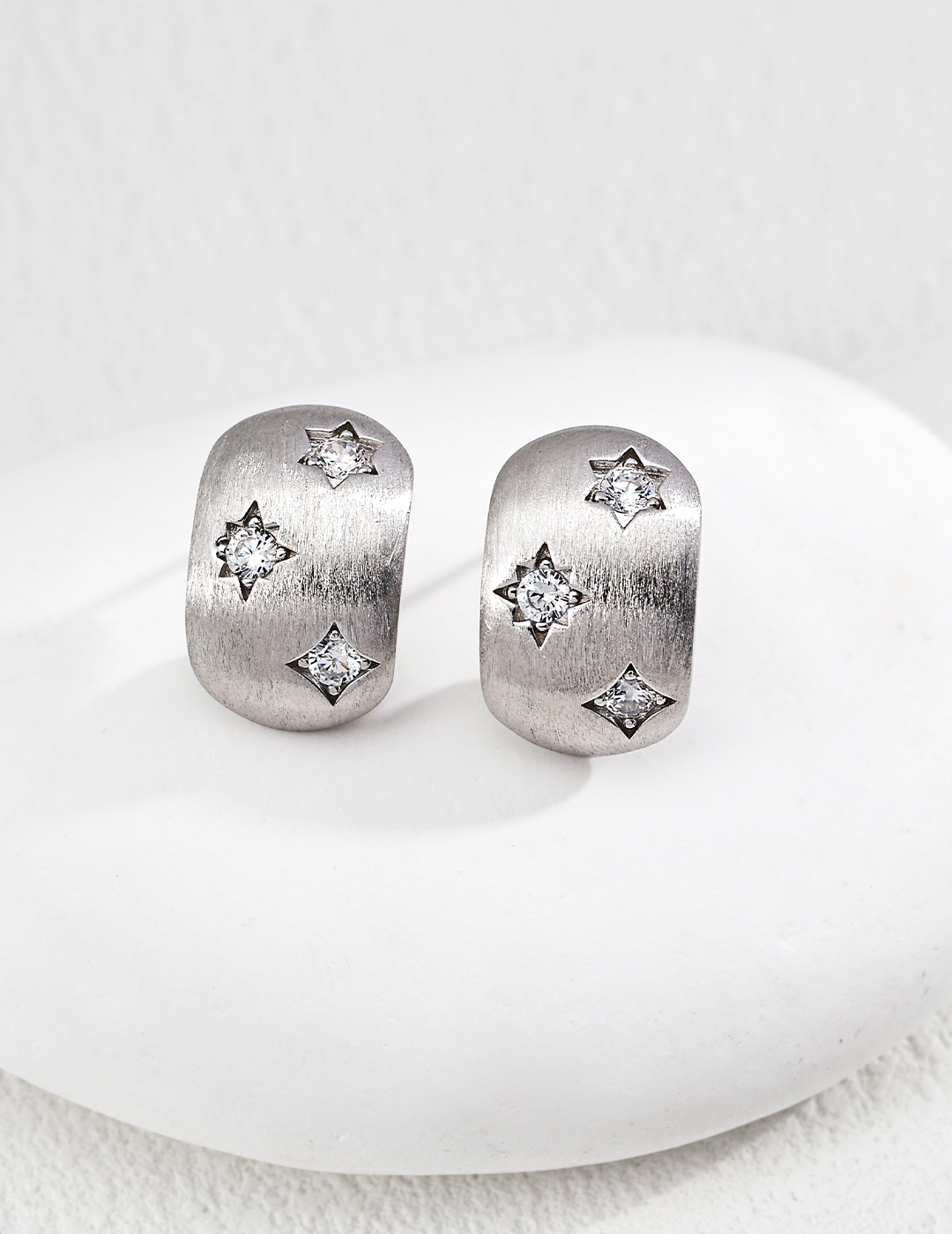 The vintage brushed metal finish creates modern and stylish stud earrings.