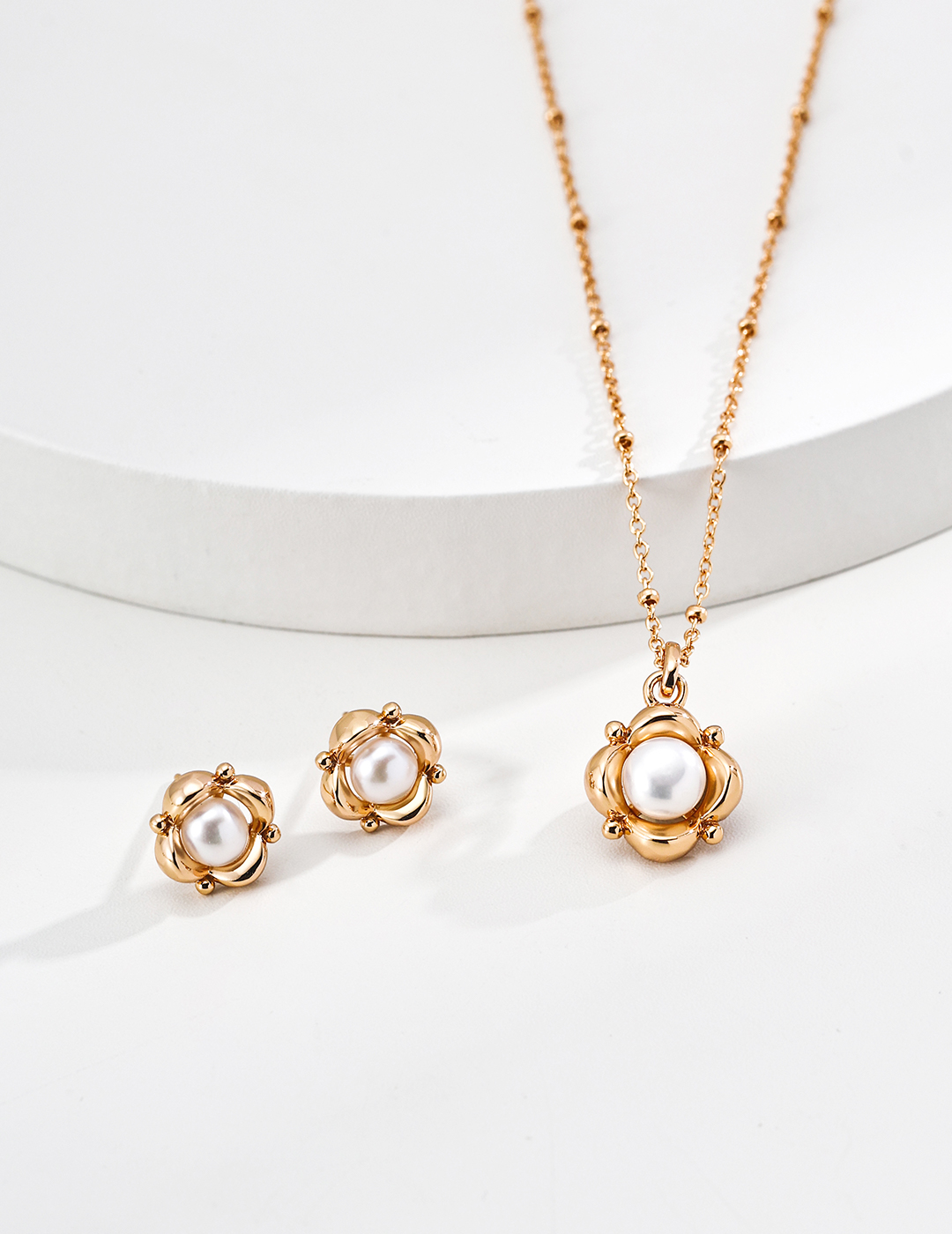 Pearls are the subtle gleam hidden near the ears, and silver jewelry cradles this gentle beauty.