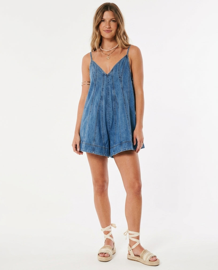Blue Charm Summer Denim Romper Blue Romper with Asymmetric silhouette and Textured texture, clean studio product view for Wedding Guest, a rooftop dinner in LA, US Coastal Glam by ads.floravincie