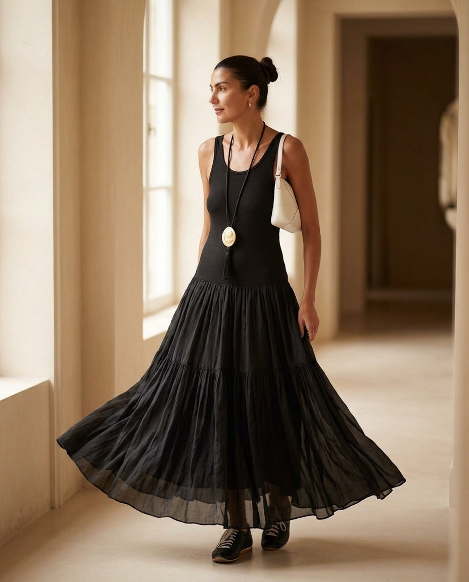 Black Charm Summer Textured Maxi Dress Black Maxi Dress with Relaxed Fit silhouette and Ribbed Knit texture, editorial ecommerce scene for Garden Party, an estate dinner at golden hour, US East / Hamptons Elite by Mesadic